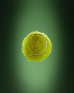 a tennis ball is flying through the air
