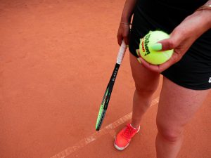 a woman holding a tennis racket